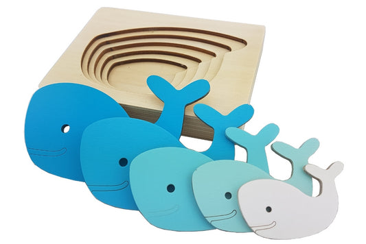 Five-layered whale puzzle. Each layer, starting from the bottom, is a progressively larger whale in a darker blue.