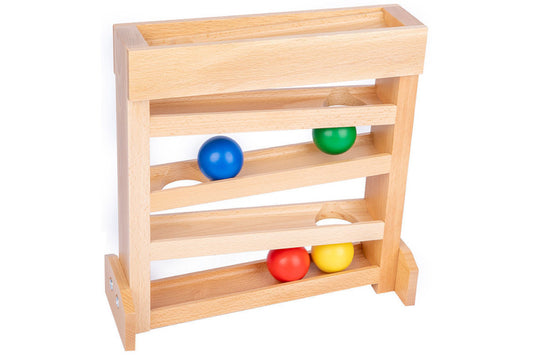 Wooden ball tracker with 4 balls in red, yellow, green, and blue. The ramp has 5 layers, the top four of which are slanted and each have a hole for the balls to fall through to the layer beneath.