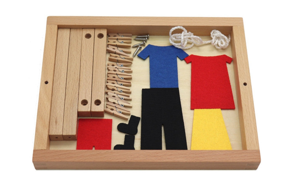 Unassembled clothesline activity lays flat into the wooden base for compact storage. Set contains wooden beams, screws, clotheslines, felt clothing, and clothespins.