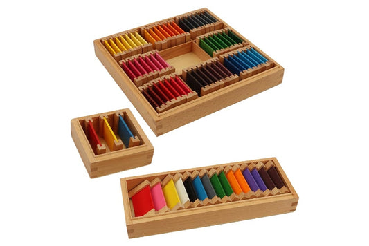 Set of three colour tablet boxes.
