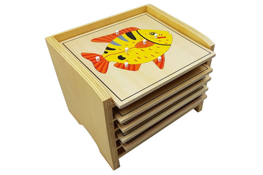 5 animal puzzles in a wooden cabinet. The fish puzzle is on top of the cabinet.