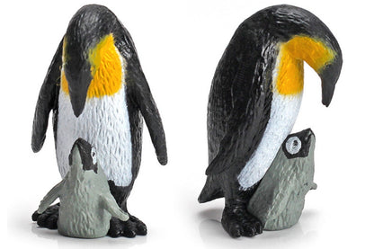 An emperor penguin and its chick, tucked between its legs for warmth.
