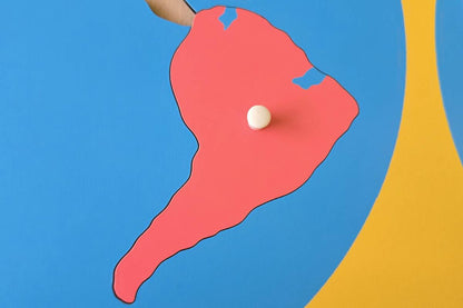 Pink piece representing South America.