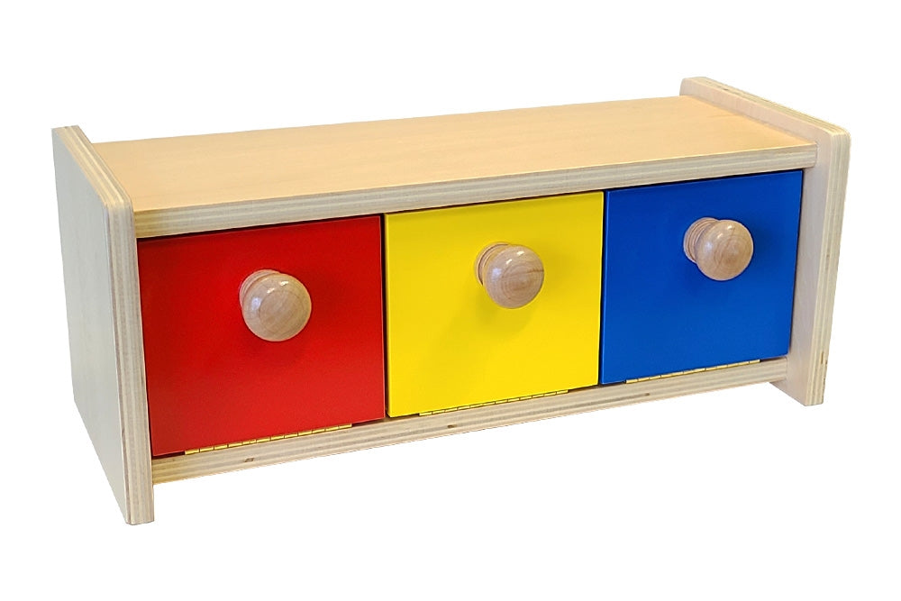 Wooden box with three bins in red, yellow, and blue. All three bins are closed.