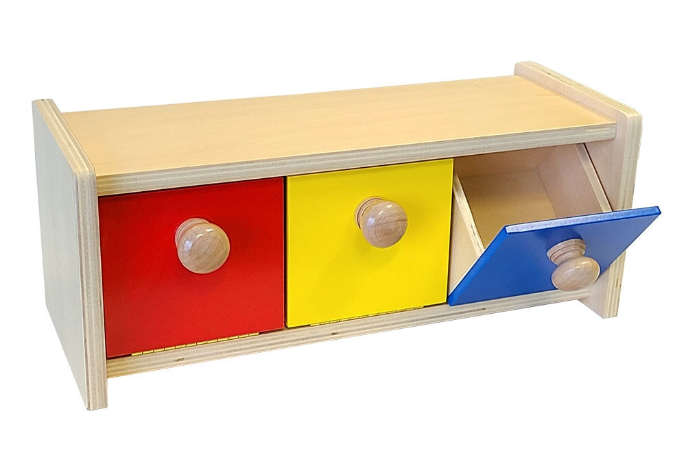 Wooden box with three bins in red, yellow, and blue. Blue bin is open, tilting outwards 45°. 
