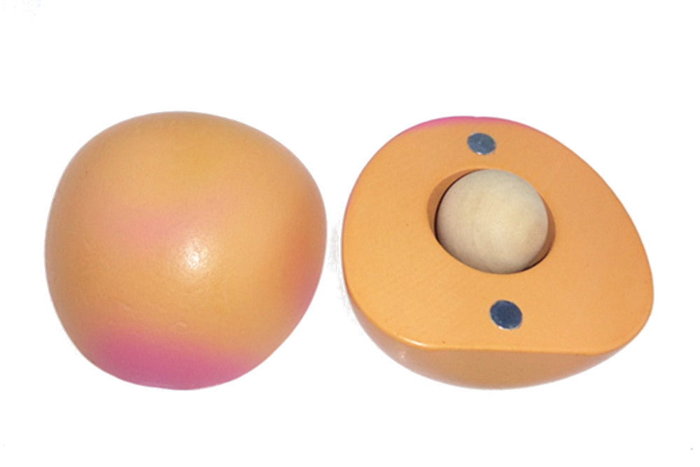 Wooden peach cut into two halves, revealing a pit in its core. Its magnets are visible. 