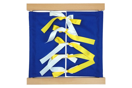 Wooden bow-tying dressing frame with blue fabric and yellow-and-white bows.
