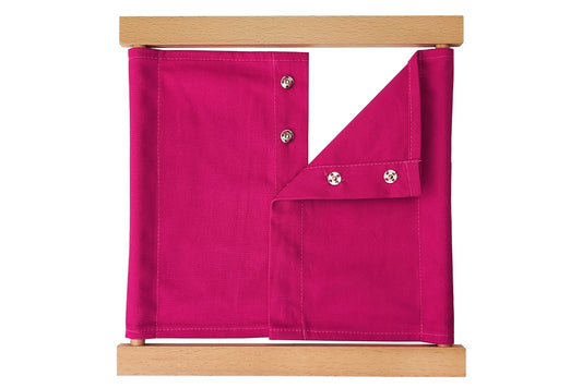 Wooden snaps dressing frame with pink fabric.